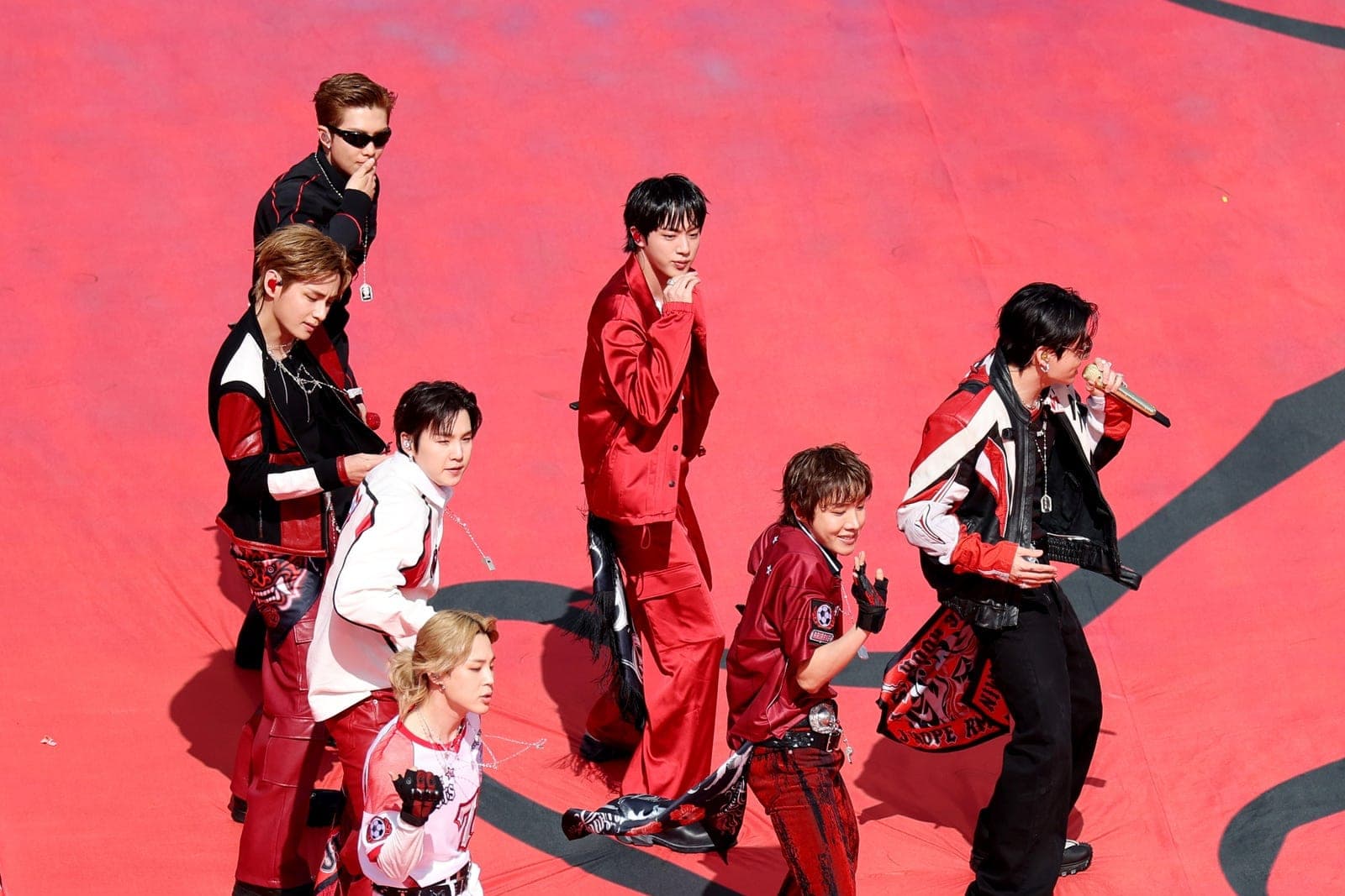 BTS photographed performing at a stadium event in 2026