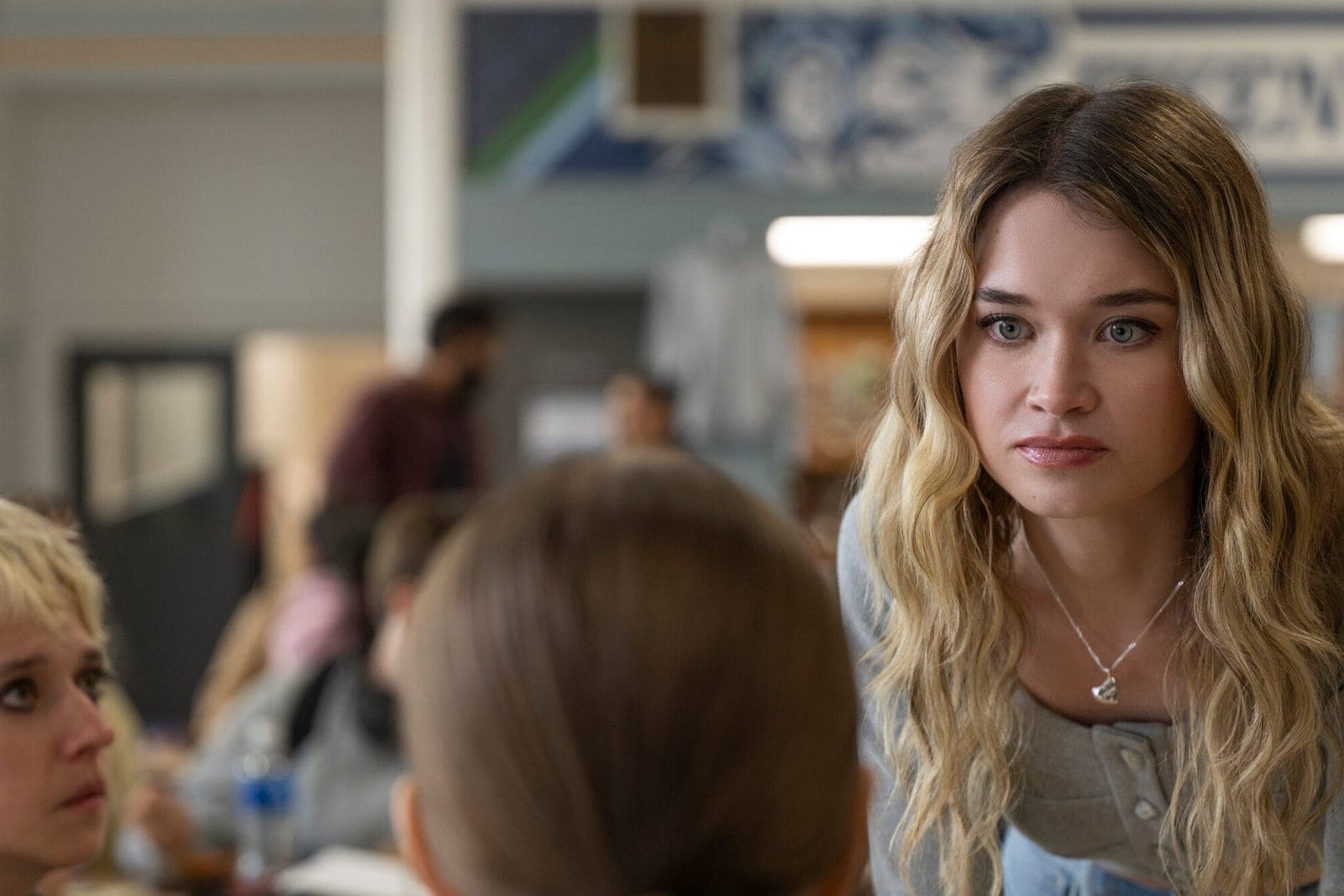 Three young actors in a scene from the Carrie series