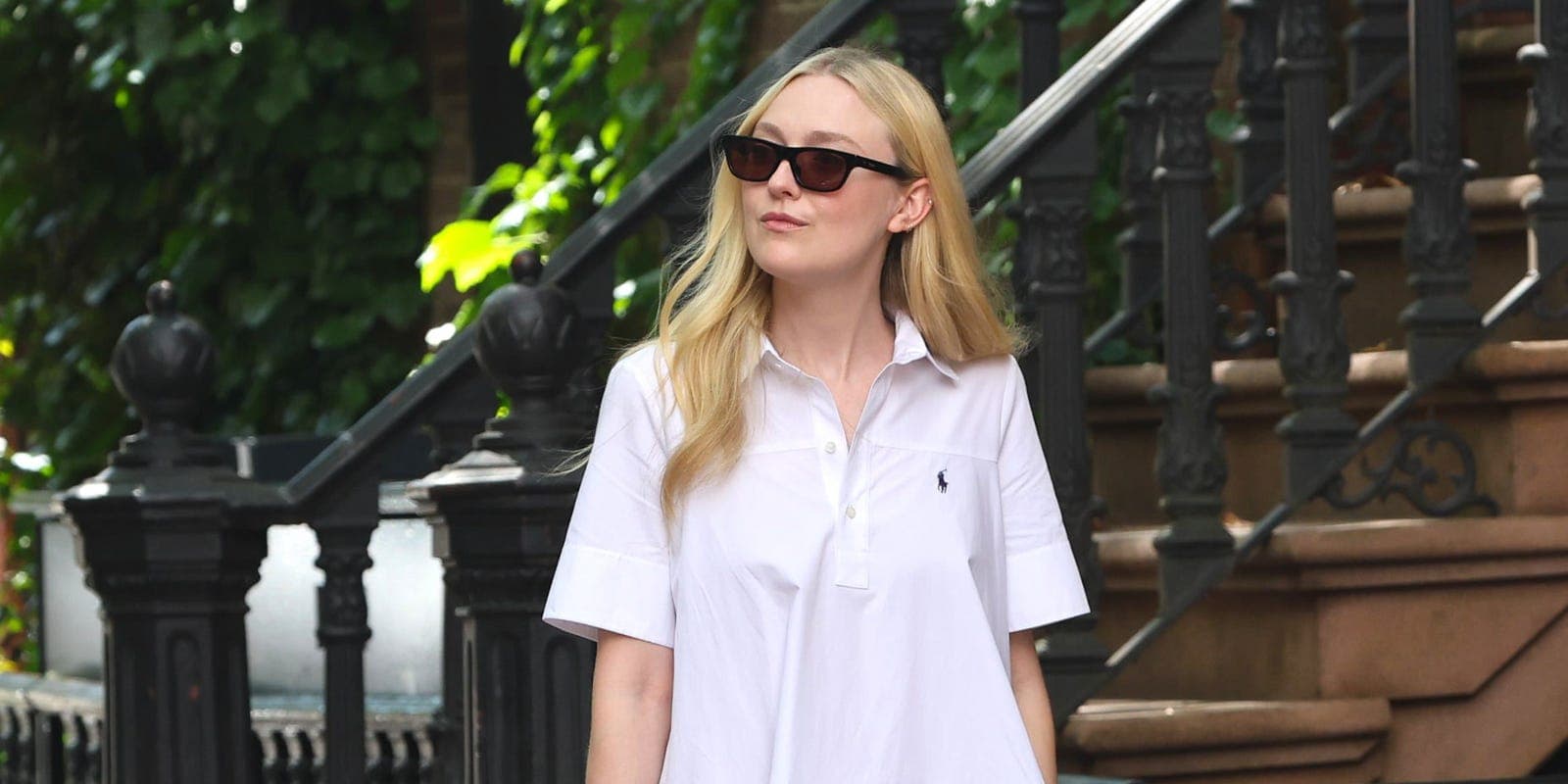 Dakota Fanning wearing a white shirtdress in New York City
