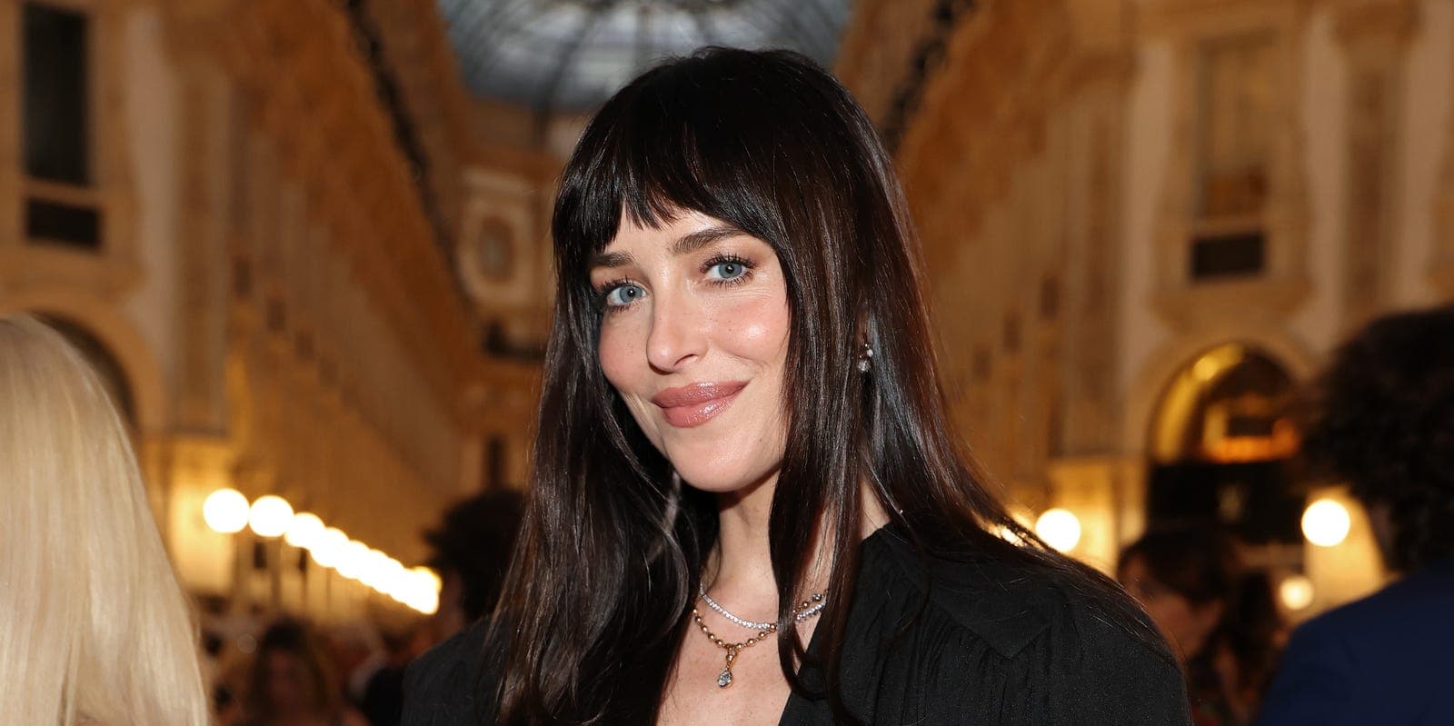 Dakota Johnson showing off a brown manicure