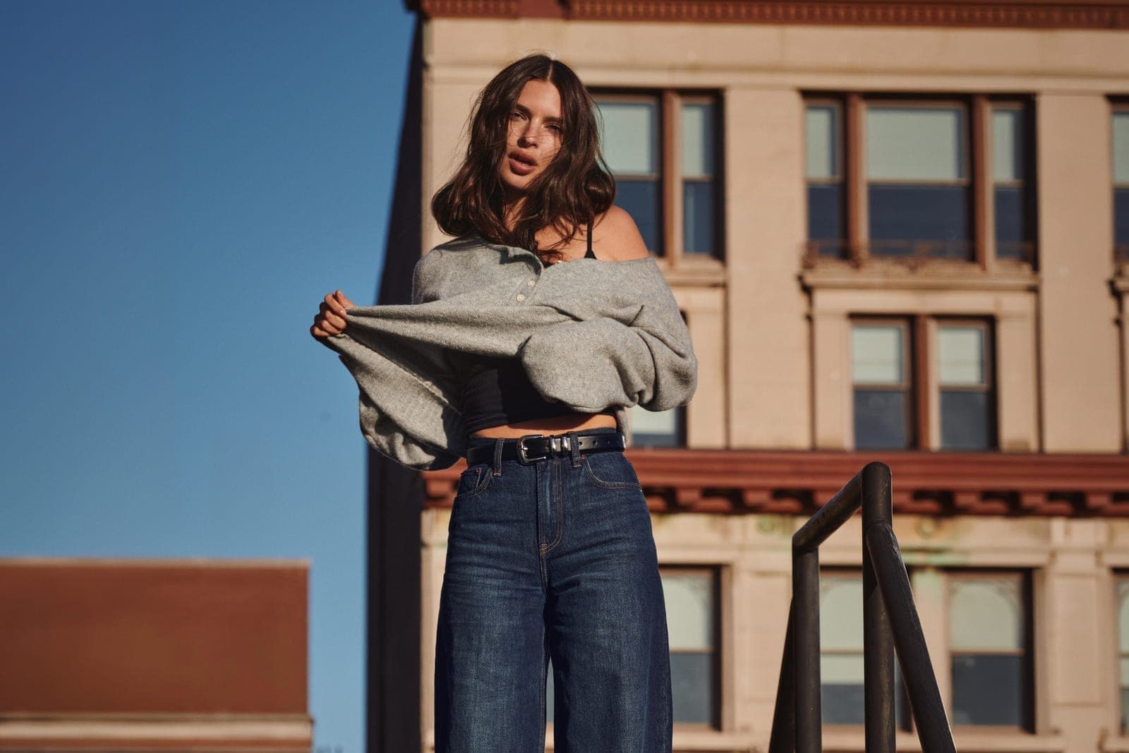 Emily Ratajkowski photographed in wide leg jeans and a knit for a denim campaign