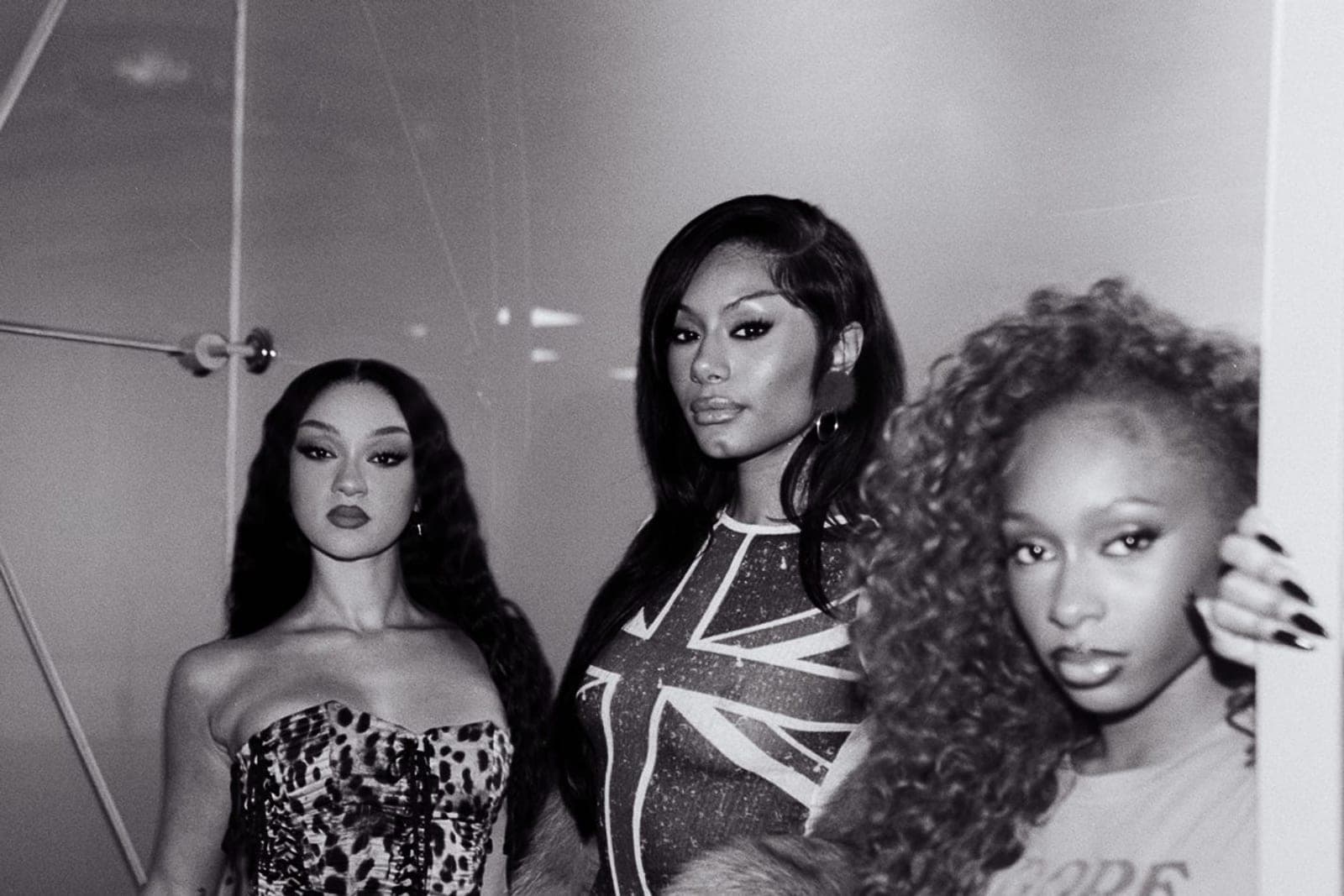 FLO photographed together ahead of the release of Therapy at the Club