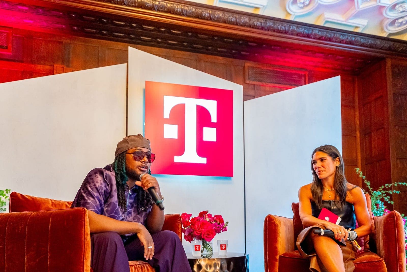 Leon Thomas seated in conversation during an interview at Lollapalooza