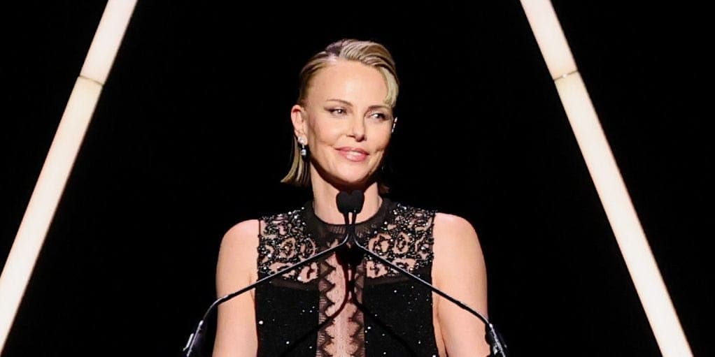 Charlize Theron at the Academy Museum Gala in a black Tom Ford gown