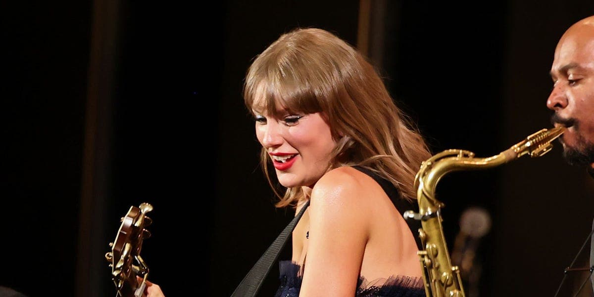 Taylor Swift performing at the Academy Museum Gala in a Ralph Lauren dress