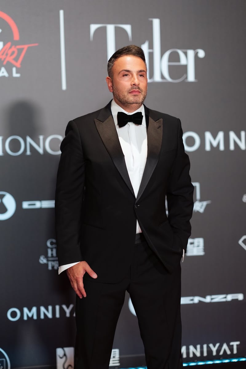Maxim Berin photographed on a red carpet in black tie